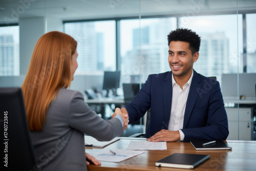 Wallpaper Mural A woman shaking hands with a man in an office Torontodigital.ca