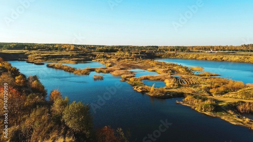 Tablou pe pânză Aerial view of flooded quarry and landscape