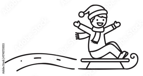 A happy child wearing a winter hat and scarf slides down a snowy hill on a sled, celebrating a fun winter activity.