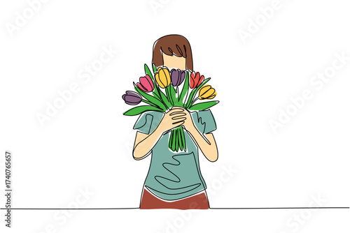 Single continuous line drawing a woman wearing a tshirt holding a bouquet of colorful tulips. Getting a surprise from her beloved partner. Flowers. Tulip Day. One line design vector illustration