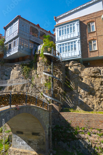 Old houses, a bridge, a spiral staircase in the historic center of Tbilisi, Georgia, near the sulfur baths