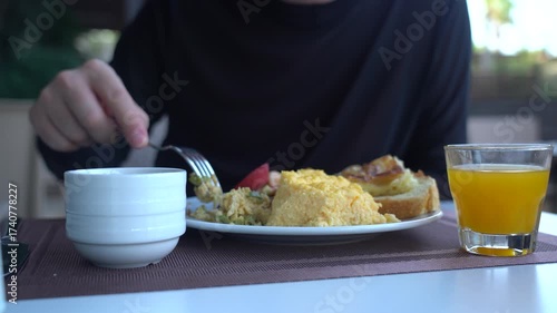 A Delightful Breakfast Spread: Freshly Served Omelet, Sauteed Vegetables, Toast, and Refreshing Juice Awaiting Enjoyment in a Cozy Dining Setting