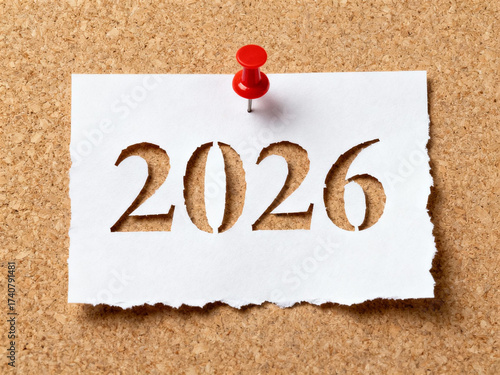 Cut-Out 2026 Number with Red Pushpin on White Paper