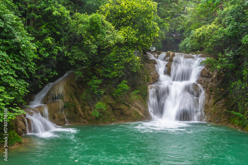 Waterfalls and streams among green mountains and clear waters in Guizhou Xiaoqikong Scenic Area