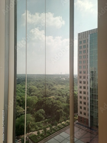Beautiful green view from the window of an office in a high rise building in Gurgaon, Haryana, India 