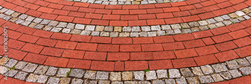 Wallpaper Mural Panoramic image. Red cobblestones arranged in round Torontodigital.ca