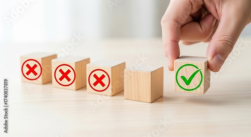 Hand Places Green Check Mark on Wood Block Near Red Cross Marks Cubes Row