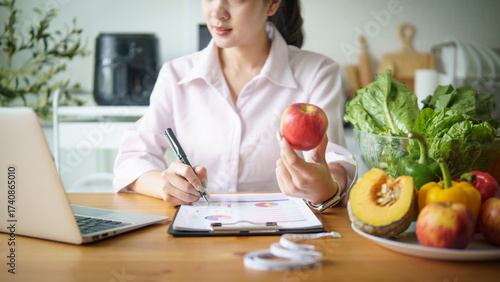 Professional dietitian preparing a nutrition plan, Concept for healthy lifestyle, telehealth, and balanced diet guidance.