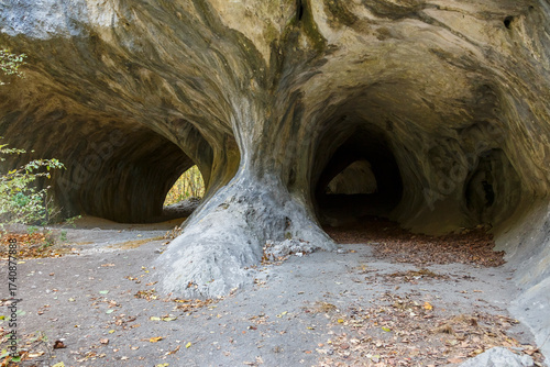 Autumn view of a cave entrance.