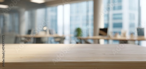 The Wooden Table in a Modern Blurred Office Interior with Bright Natural Light