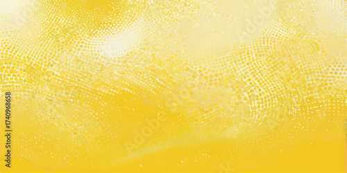 Macro closeup of a fresh, cold glass of golden beer with bubbles and foam on a yellow background showing the liquid texture