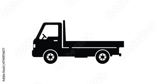 Simple silhouette of a black flatbed truck with wheels and a cab isolated on white