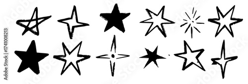Black crayon hand drawn stars set. Childish doodled sparks and sparkles collection. Grunge rough brush stroke shine element pack for collage, poster, sticker. Kid sketched wax pencil symbols. © Gayan