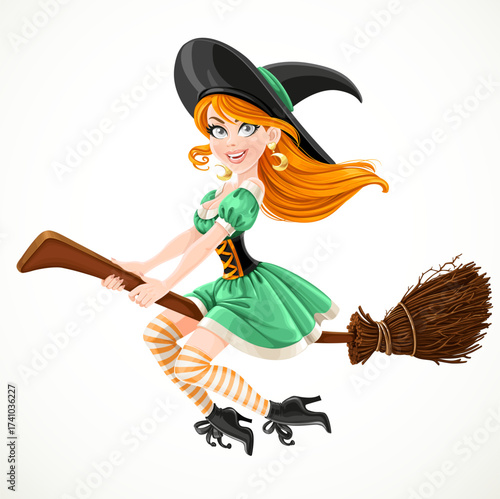 Cute redheaded witch in green dress flying on a broom isolated on a white background