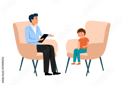 Child psychologist works with small boy on the armchair. Psychological support.