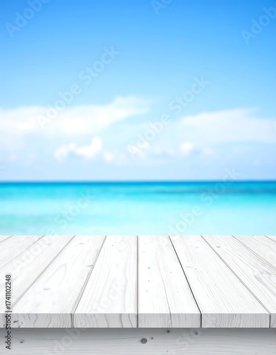 A white wooden deck overlooking a blurred turquoise sea and blue sky