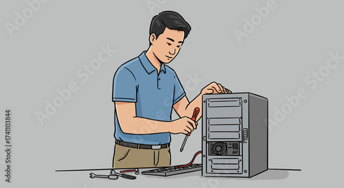 Man repairing a computer with a screwdriver