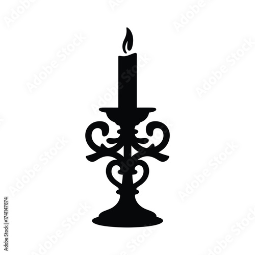 Ornate black silhouette candlestick with burning flame