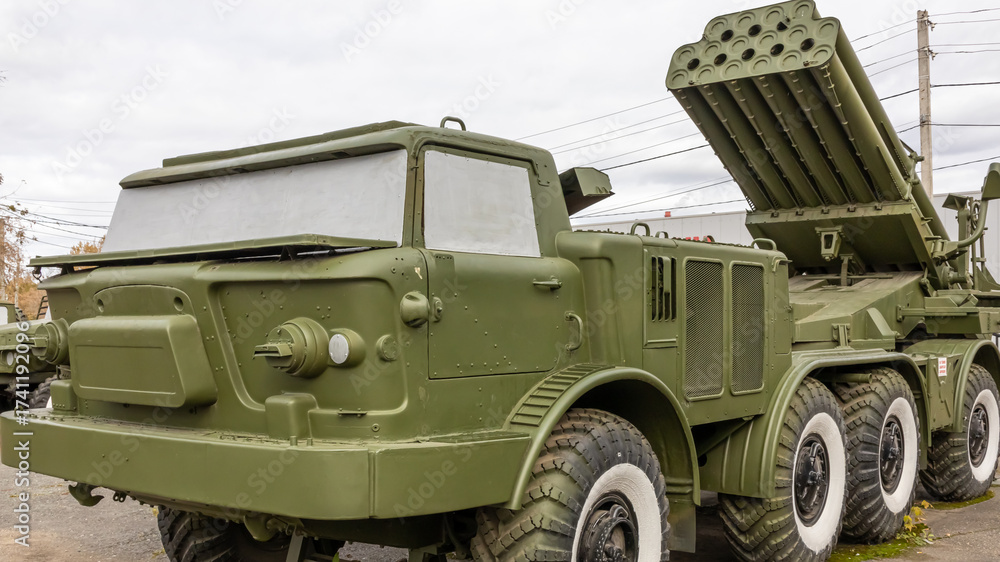 Obraz premium Soviet and Russian multiple rocket launchers. Field jet complex. A combat vehicle mounted on a truck chassis. Weapons with increased firepower. Heavy vehicle with multiple rocket launcher system.
