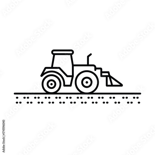 Tractor with front loader working on agricultural land