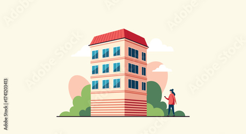 A woman is standing next to a tall building surrounded by trees.