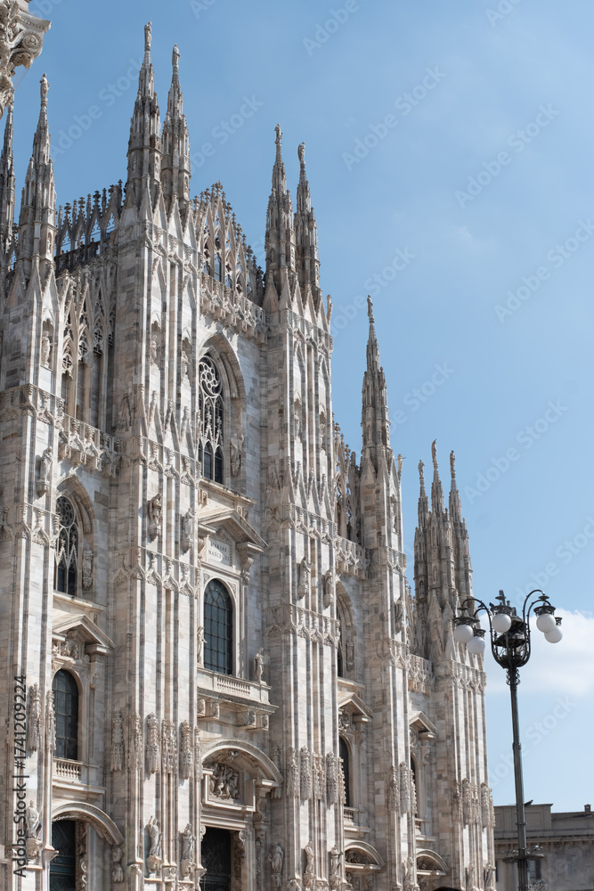 Fototapeta premium Views of central part of Milan, Brera district, shopping area, church Duomo, architectural details, streets, walking in Milan, Lombardy, Italy