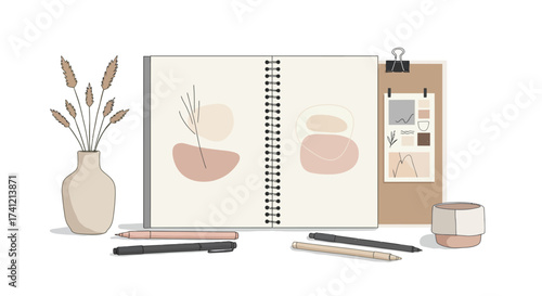 Creative workspace with sketchbook and art supplies in minimalist style