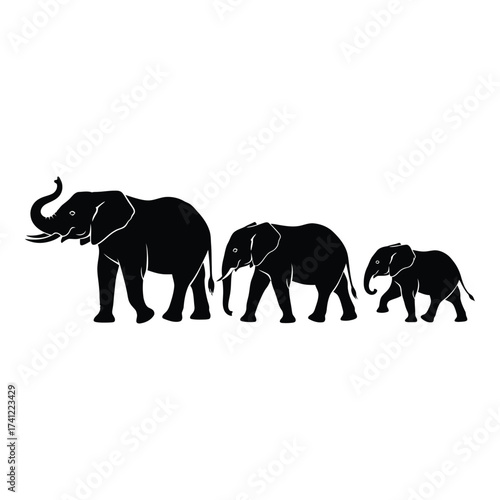 Foto Silhouettes of a family of three elephants walking together in a procession agai