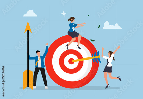 Business Team Reaching Target Goal Together with Arrow on Bullseye