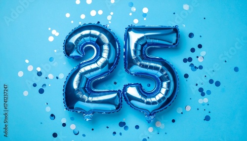Blue balloon number 25 with confetti on solid colored background. Photo for anniversary or birthday party