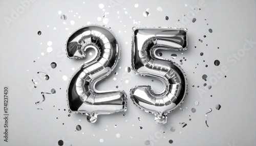 Silver balloon number 25 with confetti on solid colored background. Photo for anniversary or birthday party