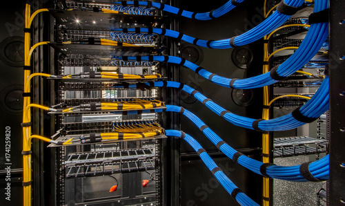 Network Server Rack with Blue Cables in Data Center