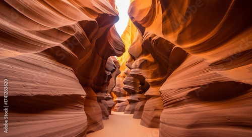 Antelope Canyon's sculpted sandstone walls create a narrow passage with light filtering from above.