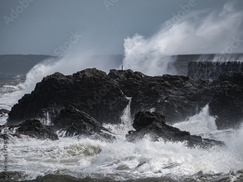 crashing waves over Holyhead breakwater isle of Anglesey