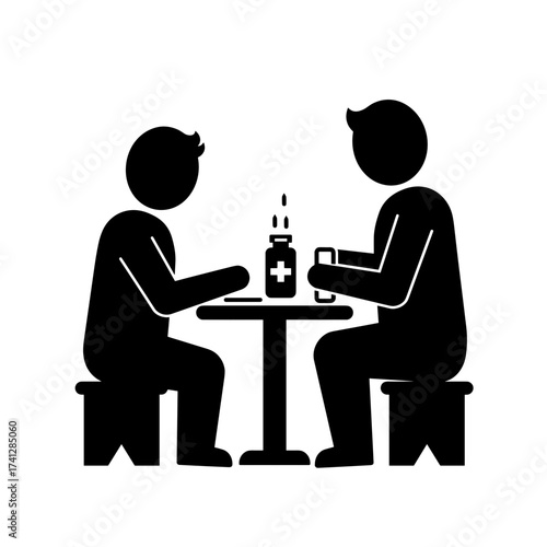 Two people participating in first aid training session at a table  