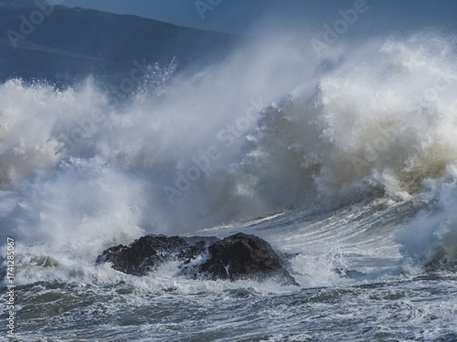 crashing waves over Holyhead breakwater isle of Anglesey