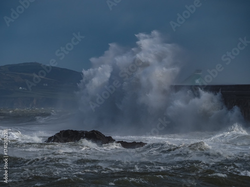 crashing waves over Holyhead breakwater isle of Anglesey