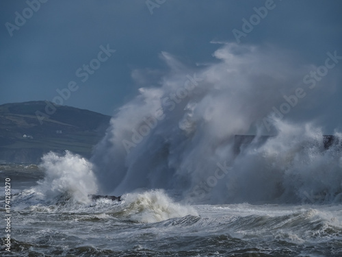 crashing waves over Holyhead breakwater isle of Anglesey