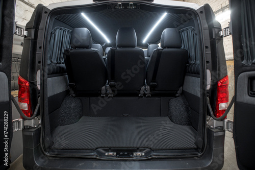 Comfortable interior of a passenger bus with soft seats