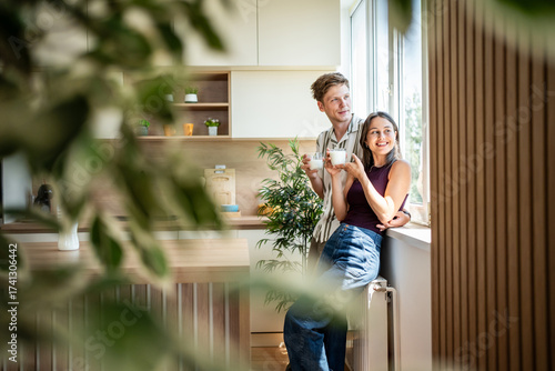 Papier peint Couple enjoying morning coffee together in comfort of home