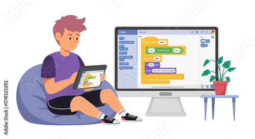 Young boy learning to code on a tablet next to a computer screen displaying programming blocks.