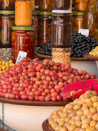 Different types of olives on the market in Morocco, olives in jars, different flavors