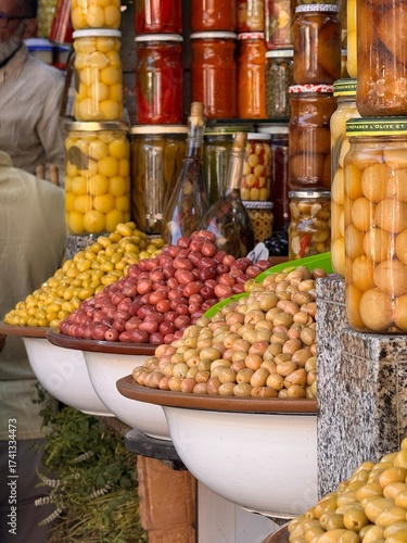 Olives on the counter at the Moroccan market, olives in jars, different flavors