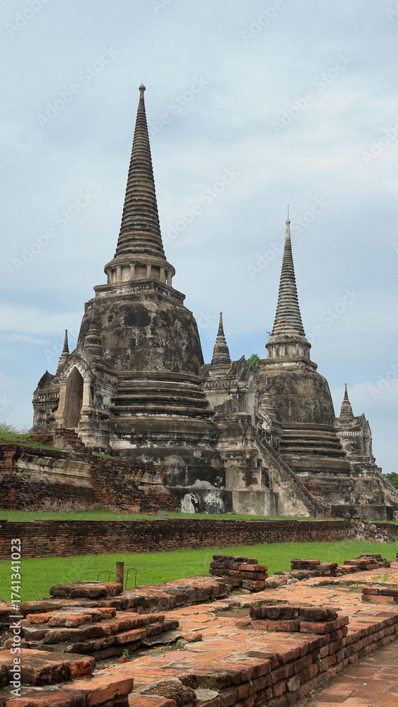 Fototapeta premium The three pagodas of Wat Phra Si Sanphet in Ayutthaya historical park, Ayutthaya, Thailand. Scenic ruins of the Buddhist temple in the ancient city.