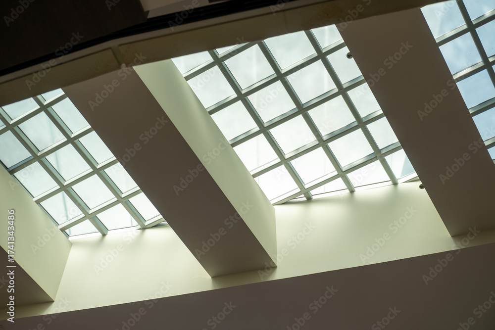 Fototapeta premium Abstract, minimalist, modern architectural space with concrete walls and opening skylight