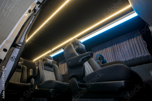 Comfortable interior of a passenger bus with soft seats