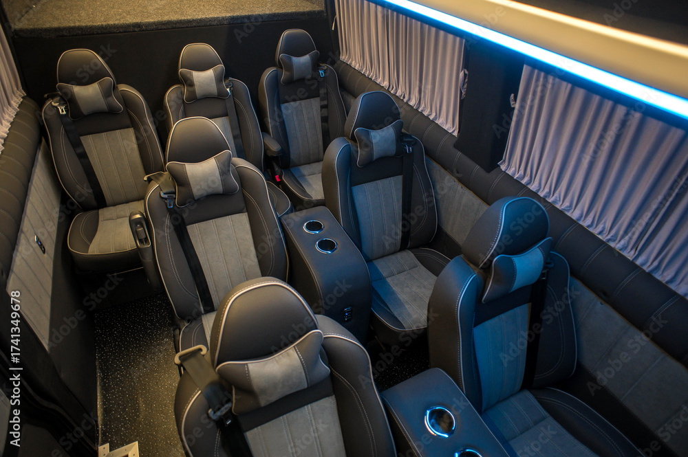 Fototapeta premium Comfortable interior of a passenger bus with soft seats