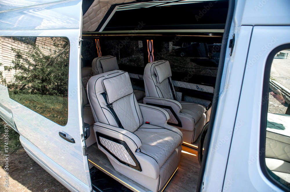 Fototapeta premium Comfortable interior of a passenger bus with soft seats