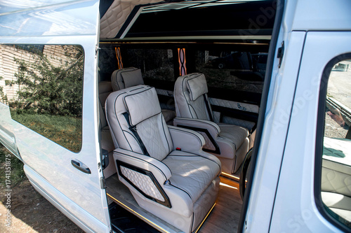 Comfortable interior of a passenger bus with soft seats