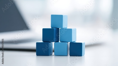 A stack of blue wooden blocks on a table